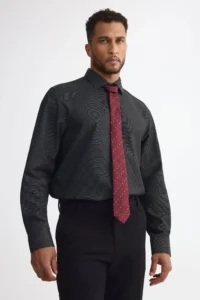 Grey shirt paired with a red tie for a modern professional outfit