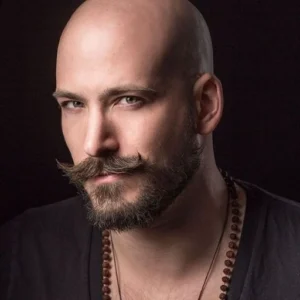 man with handlebar moustache and beard