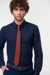 Navy blue shirt paired with a burgundy tie for business attire